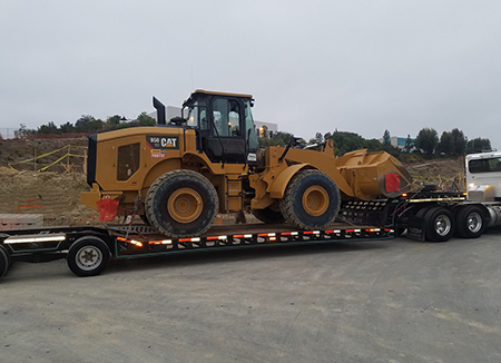 Photo Of An Edmondson Construction CAT 950 Loaded On A Flat Bed Trailer Ready For Delivery